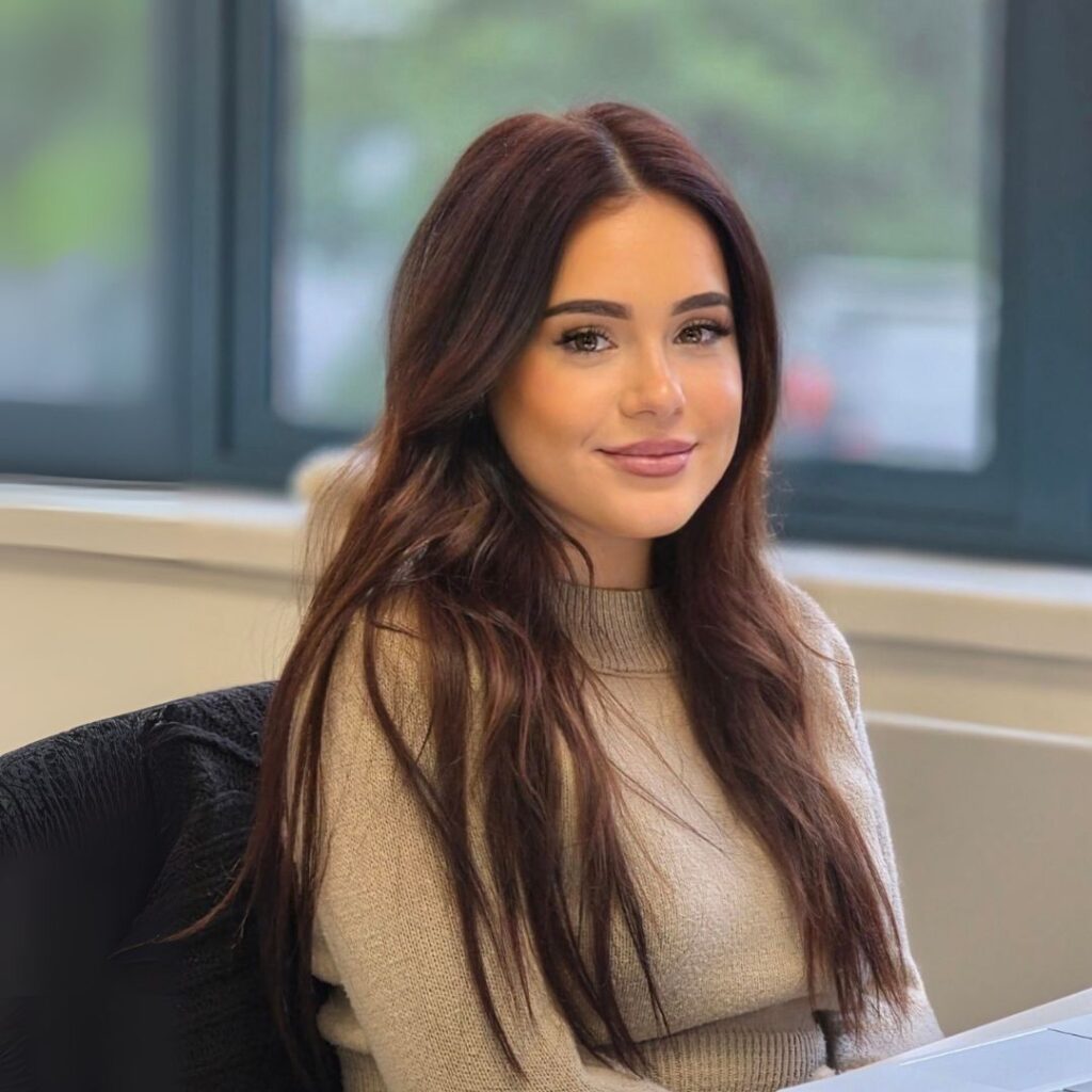 Mia Walsh James, Accounts Assistance of Neutronic Technologies Ltd., seated at her office desk.